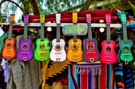 Fototapety Colorful Ukeleles on an outdoor cart